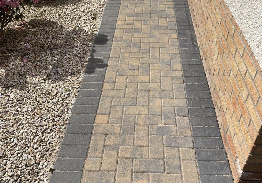 Clean block paving path with charcoal border in East Lothian