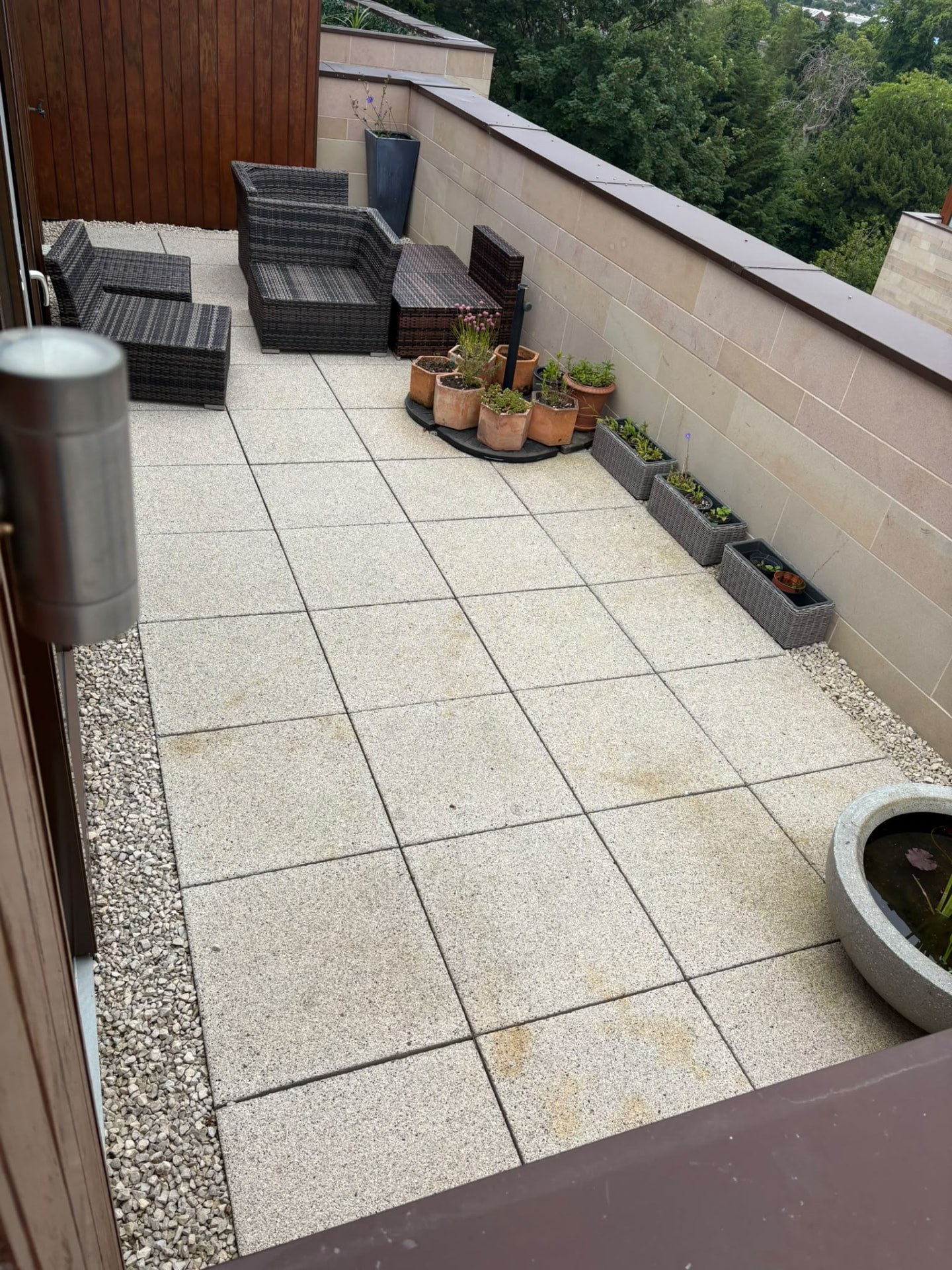 Clean light grey slab patio after power washing in Midlothian