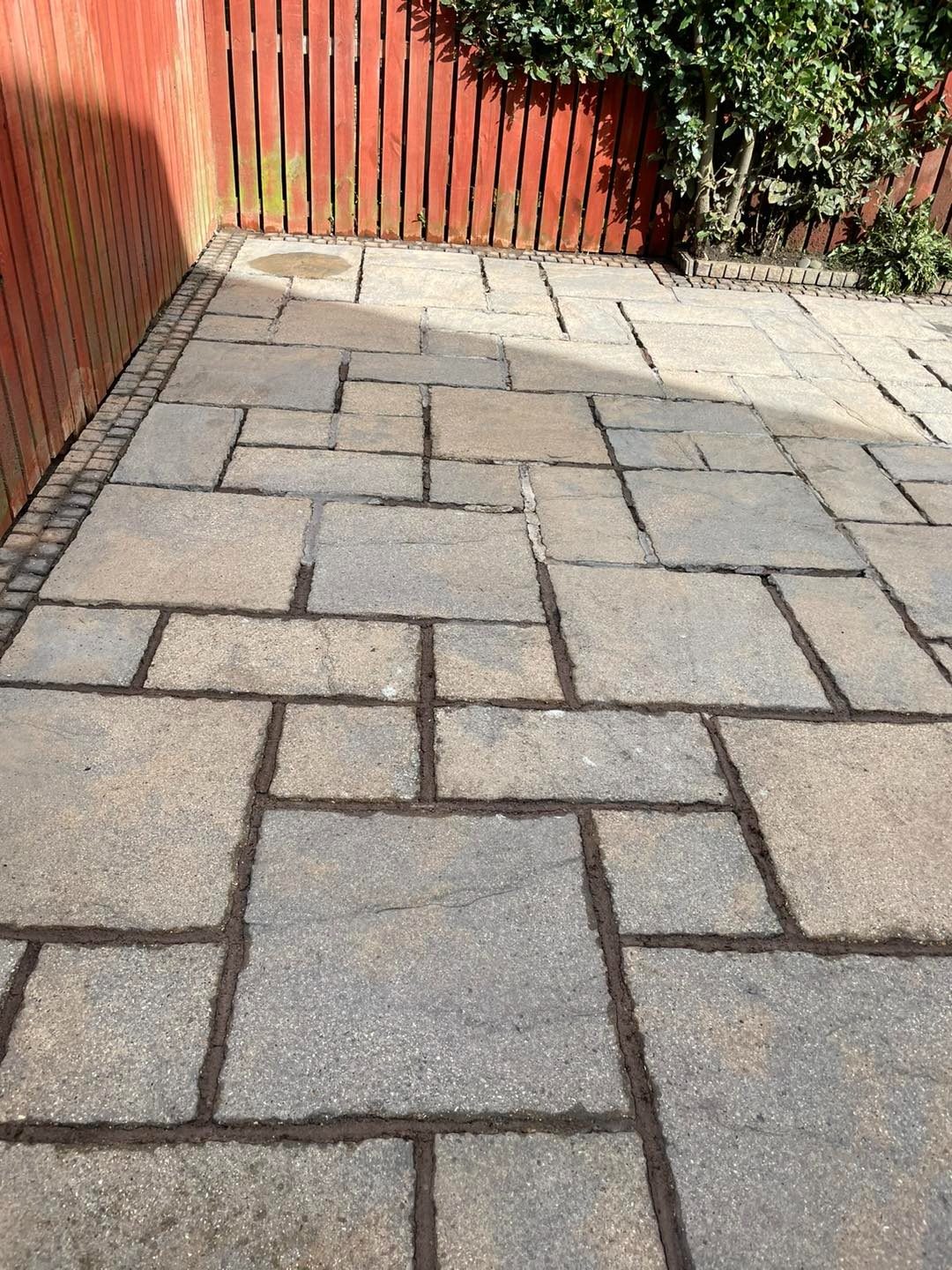 Clean sandstone slab patio after power washing in Midlothian