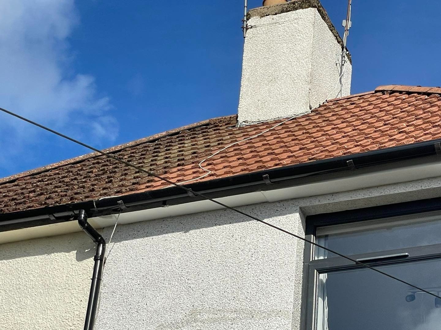 Clear terracotta tiled roof after moss removal in East Lothian