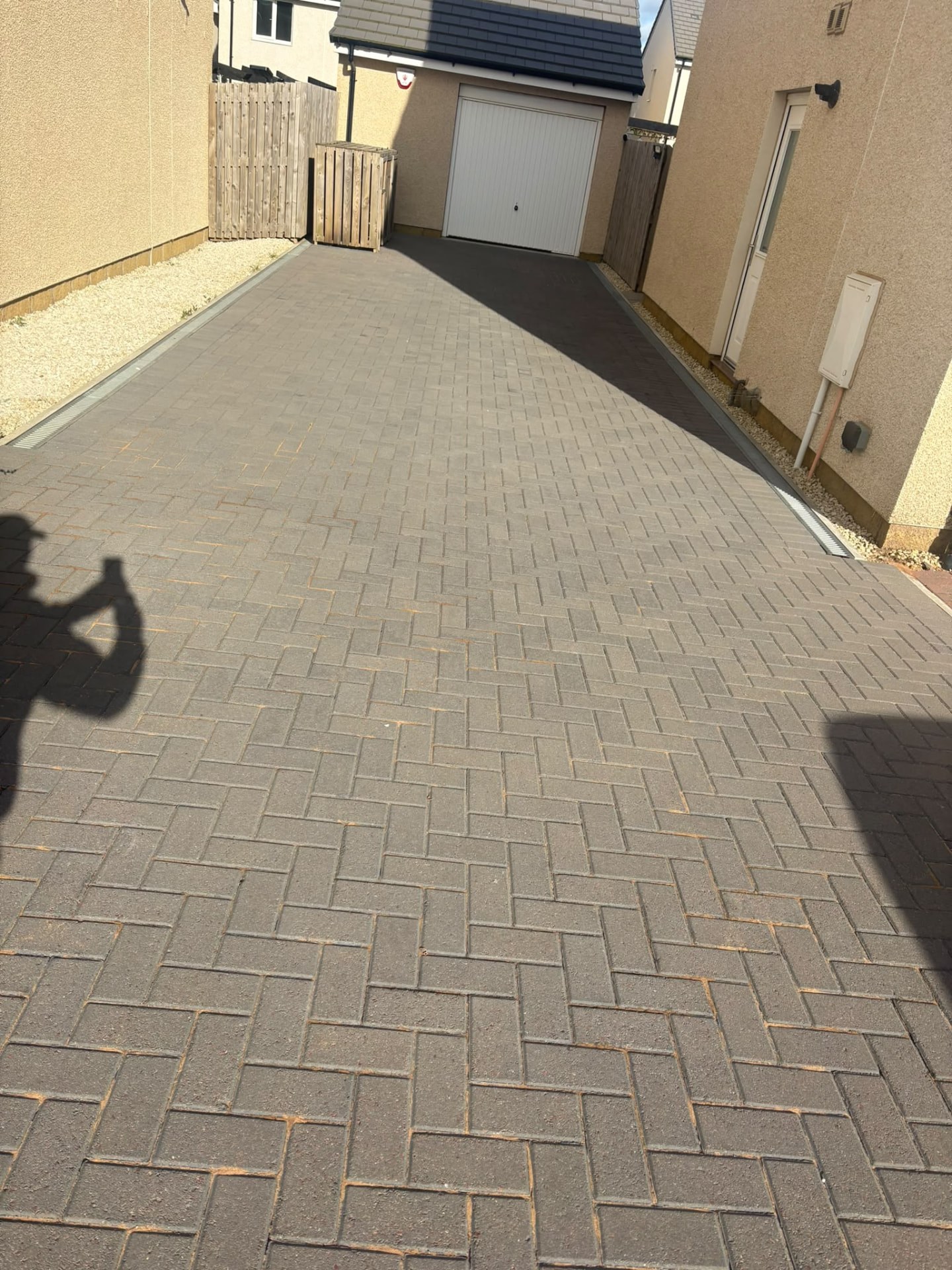 Clean grey block paving driveway after power washing in Midlothian
