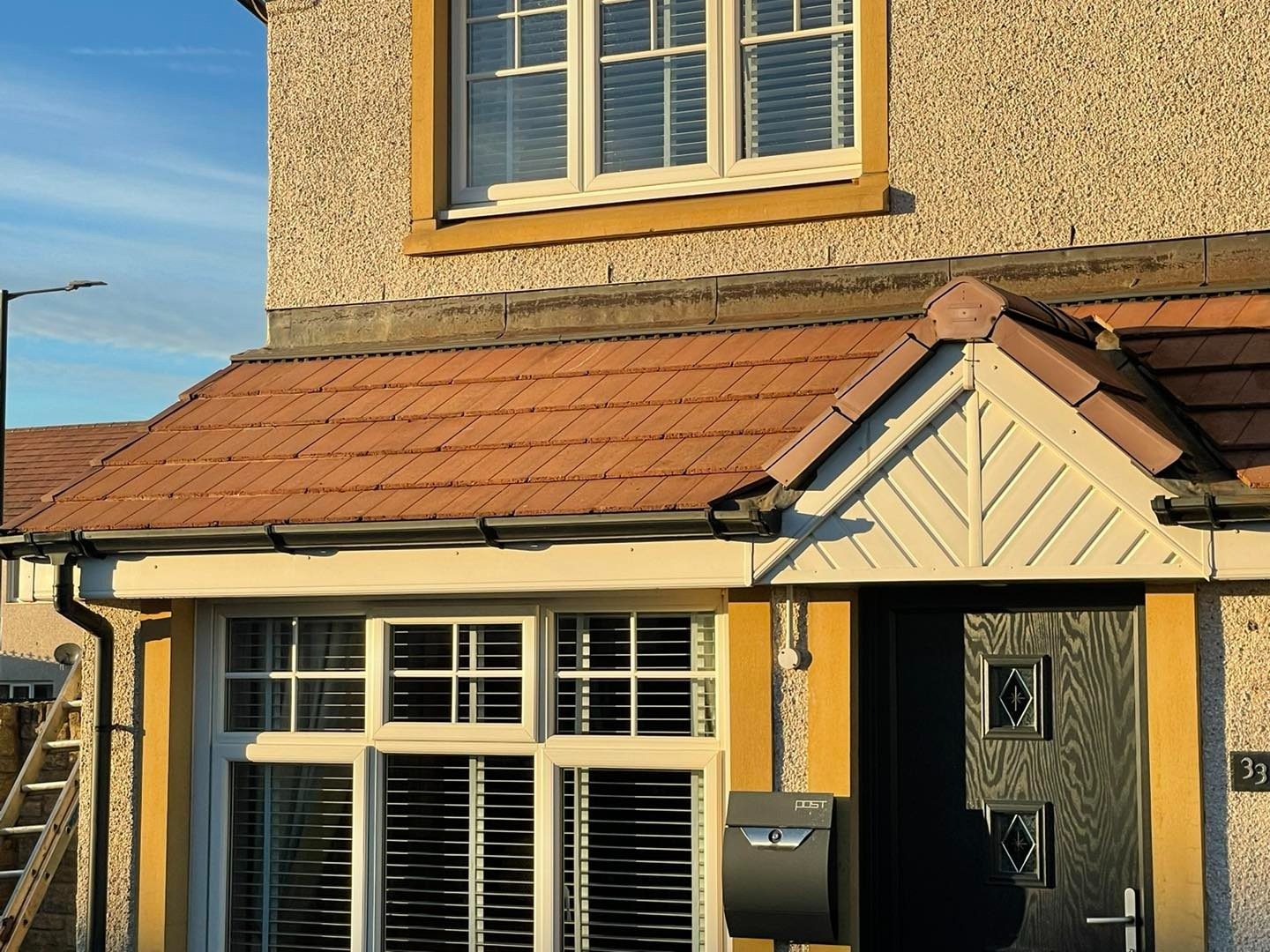 Clean tiled porch roof after hand roof cleaning in East Lothian