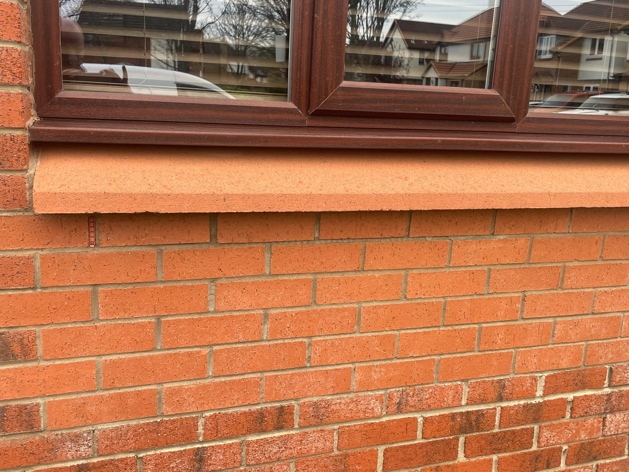 Clean red brick wall and window sill after masonry cleaning in Midlothian